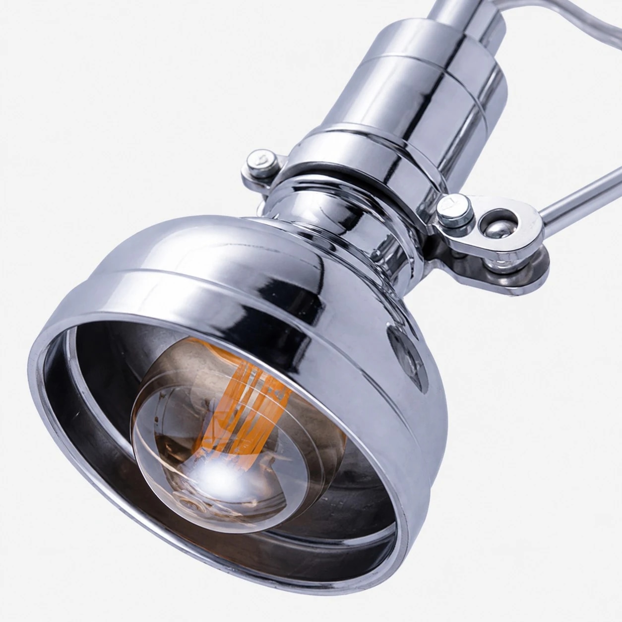 Close view of the natural aluminum wall sconce shade and metal hardware