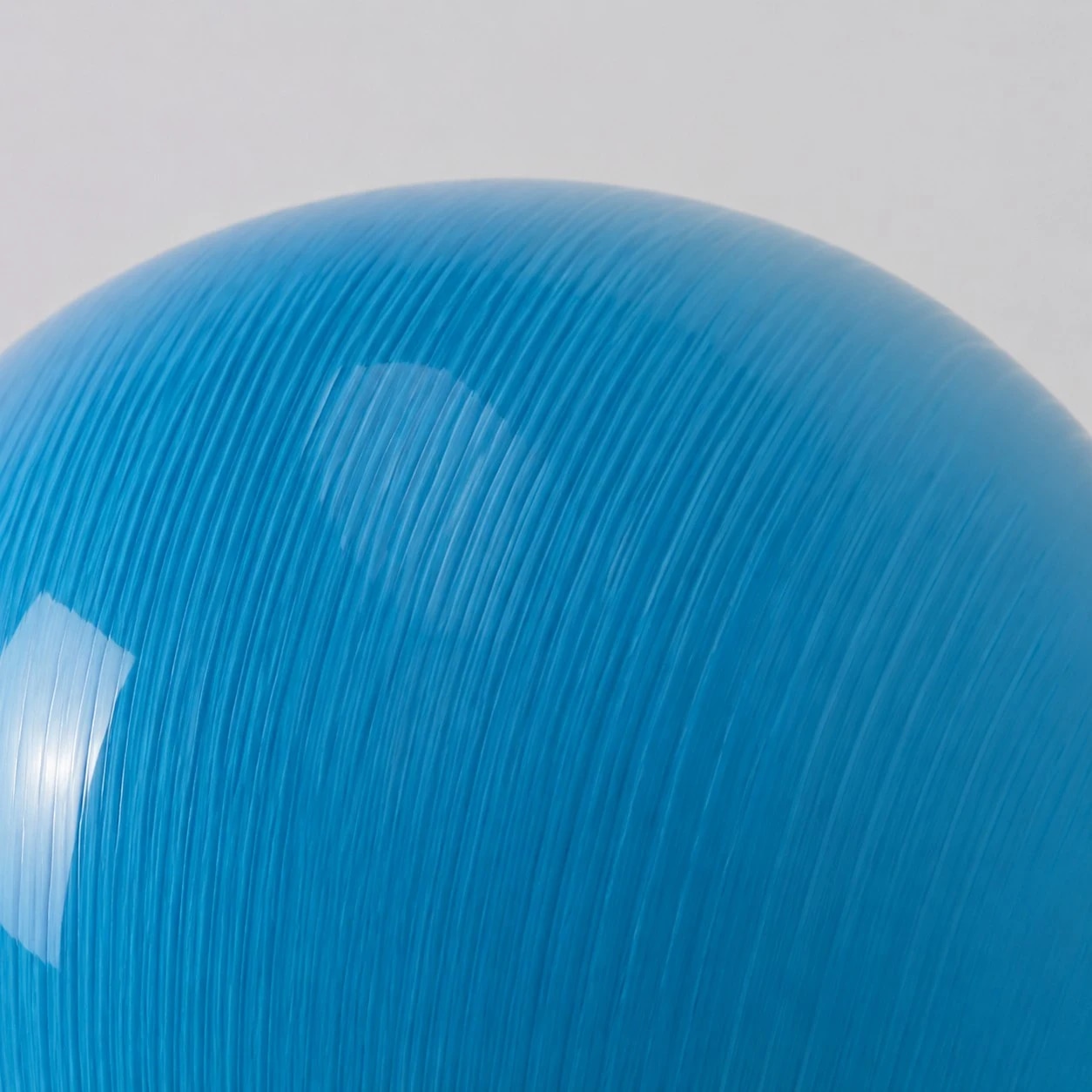 Blue ribbed glass texture close-up