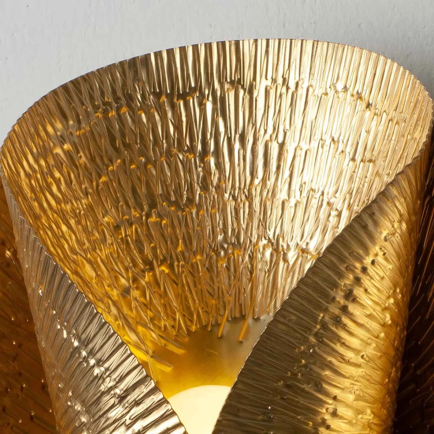 Close-up of layered hammered brass shade
