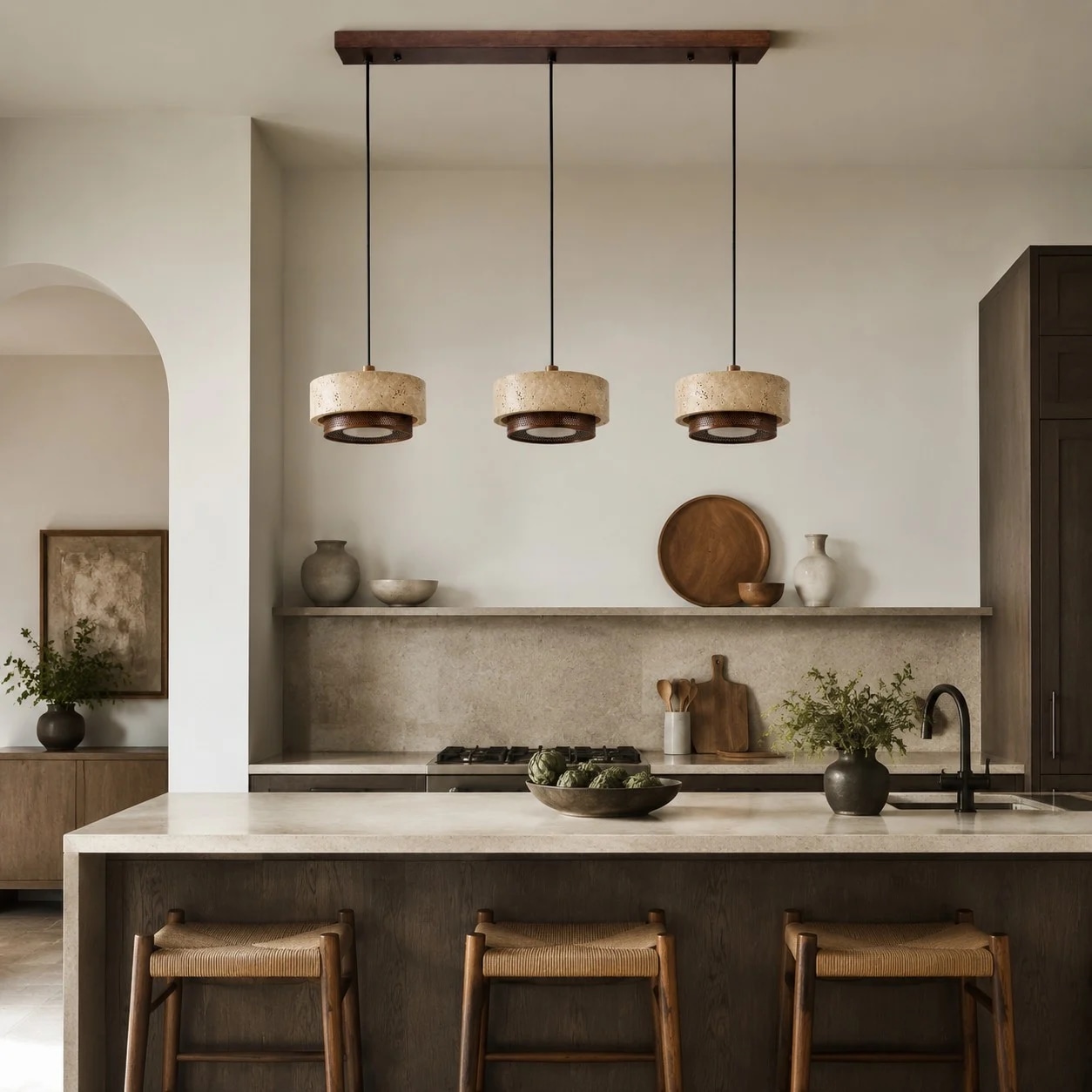 three head travertine walnut pendant light installed over a kitchen island