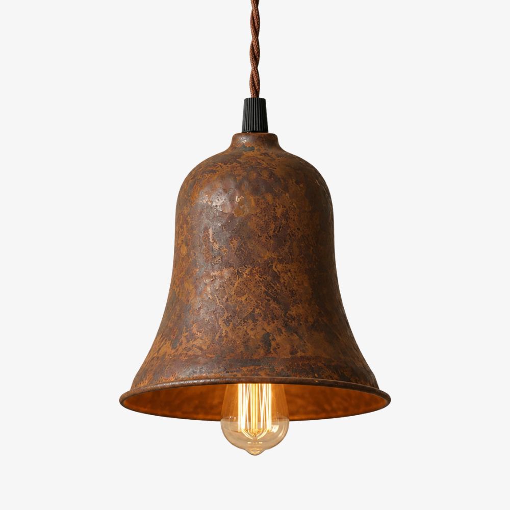 Rust metal bell shade pendant light with warm exposed bulb