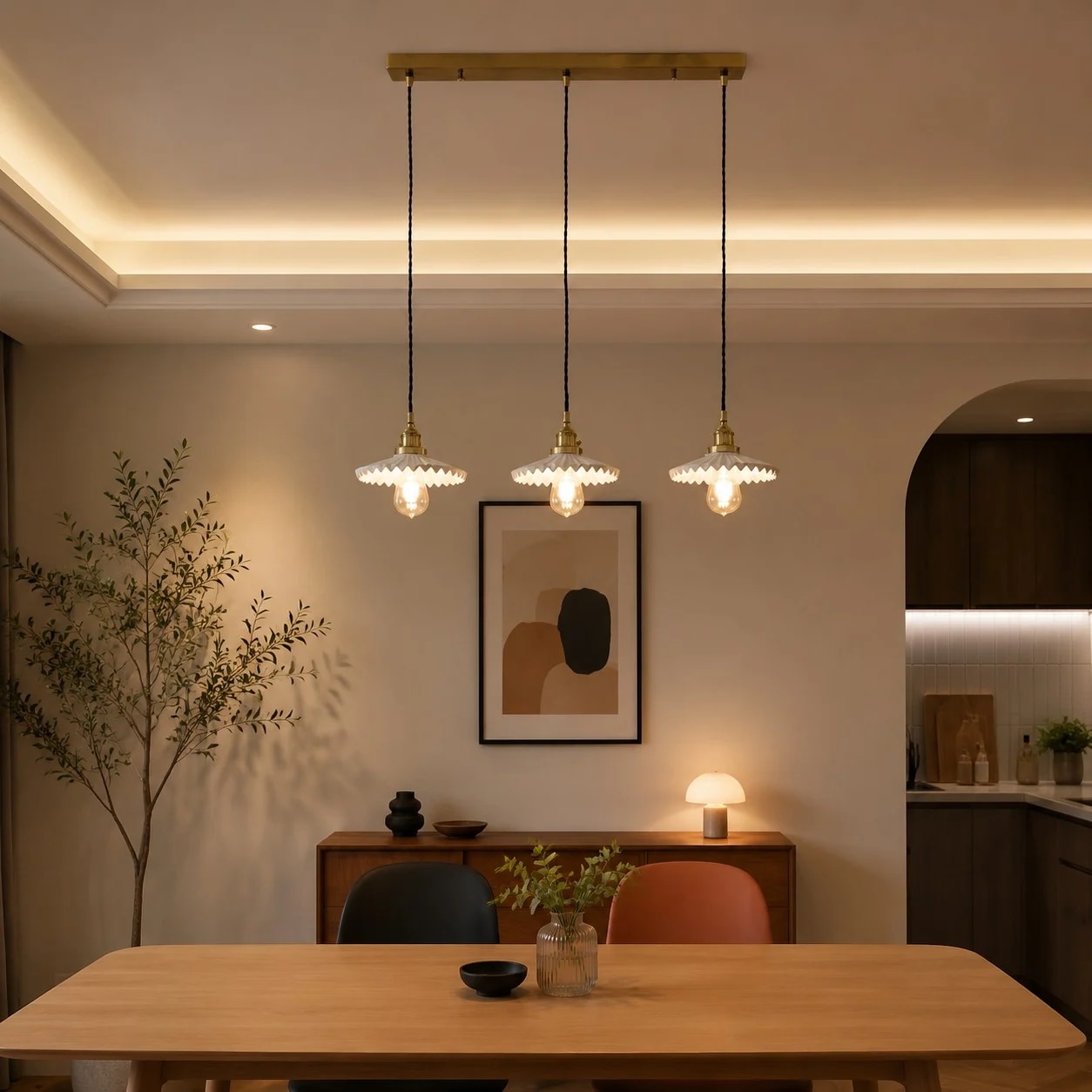 Three-light pendant installed above a table