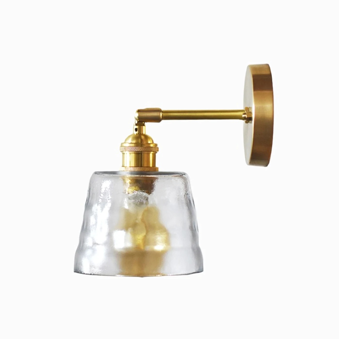 single brass and clear glass wall sconce