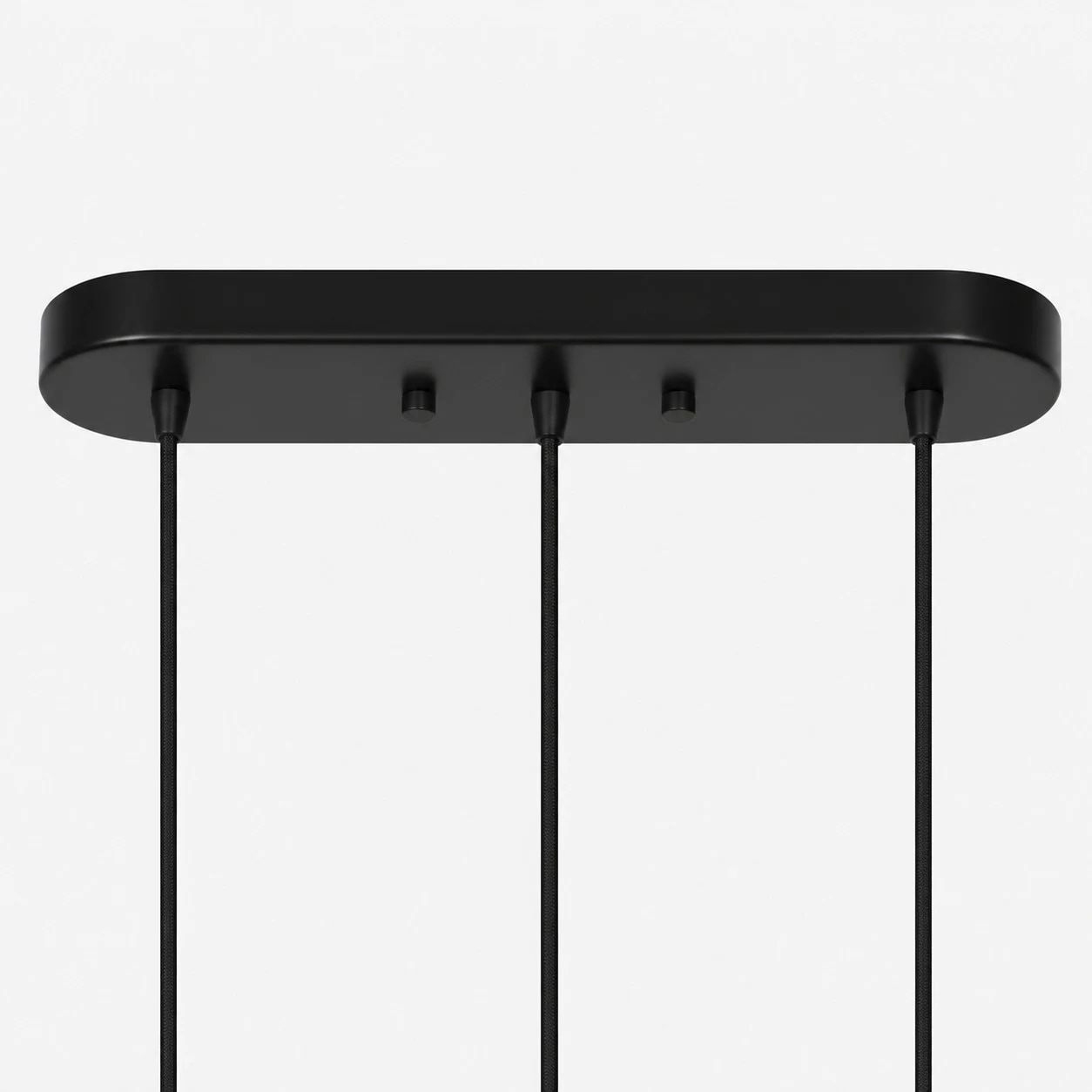 Rectangular black ceiling canopy detail for the linear three-light pendant