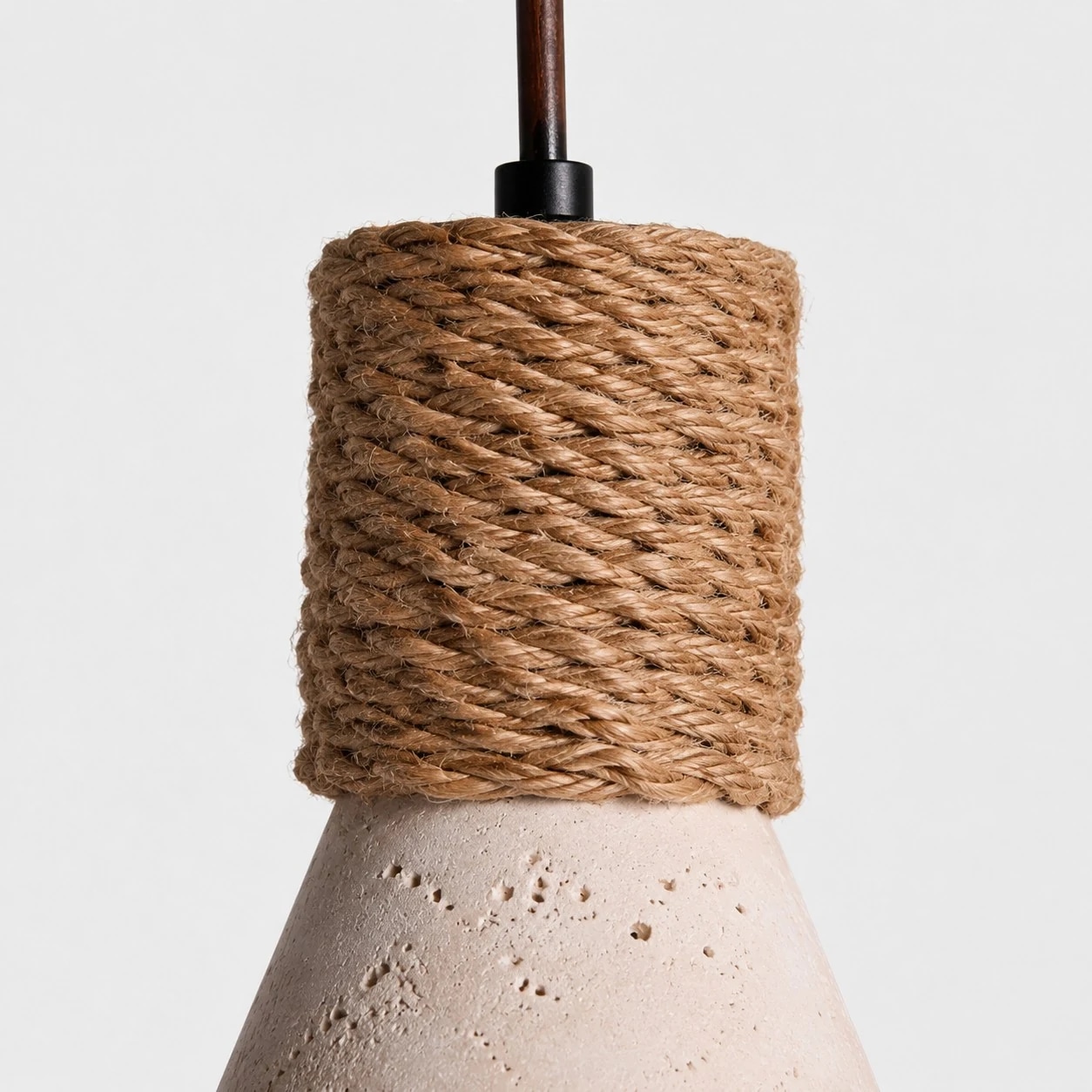 Close-up of woven upper texture and carved stone-look pendant shade