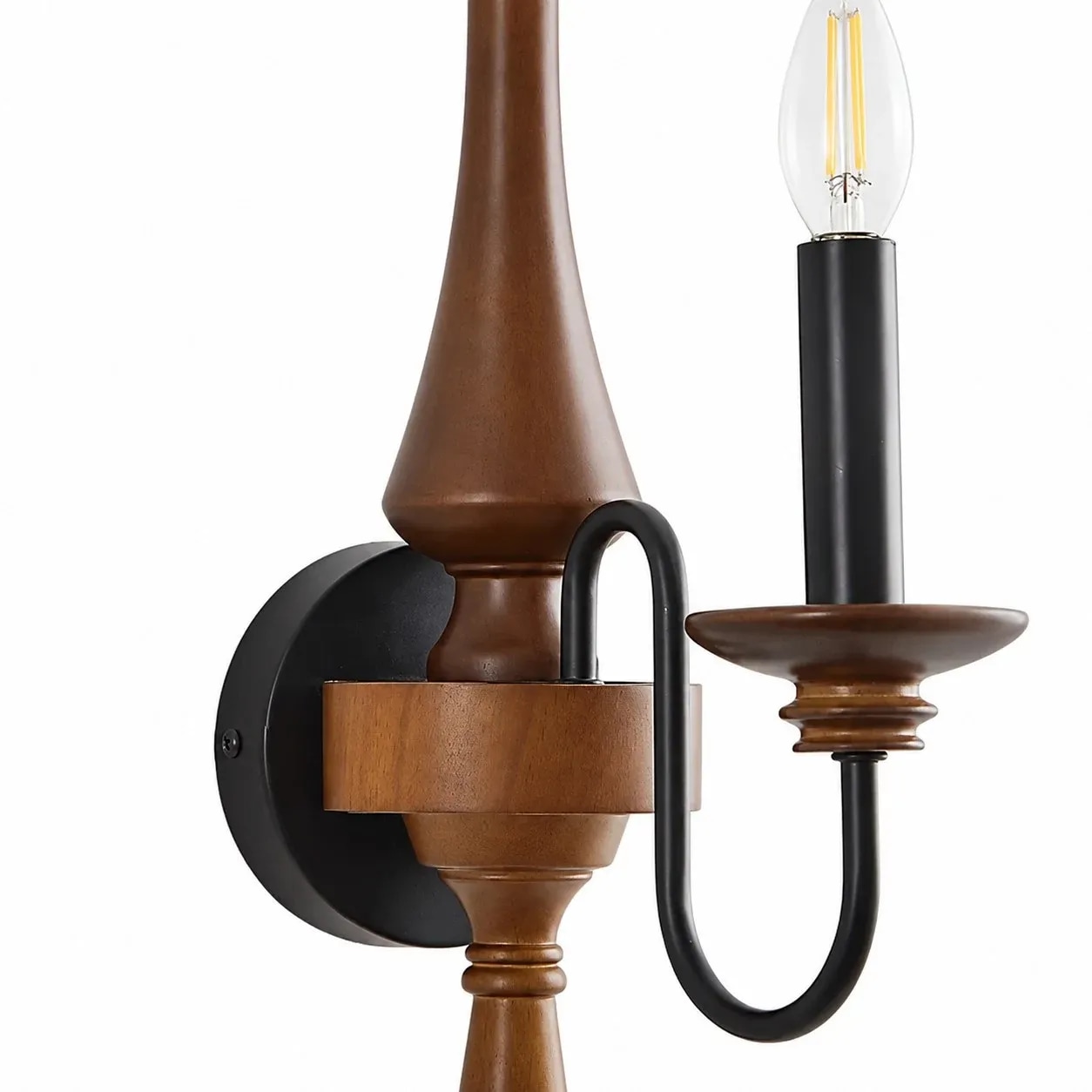 Wood and iron detail of vintage candle wall sconce
