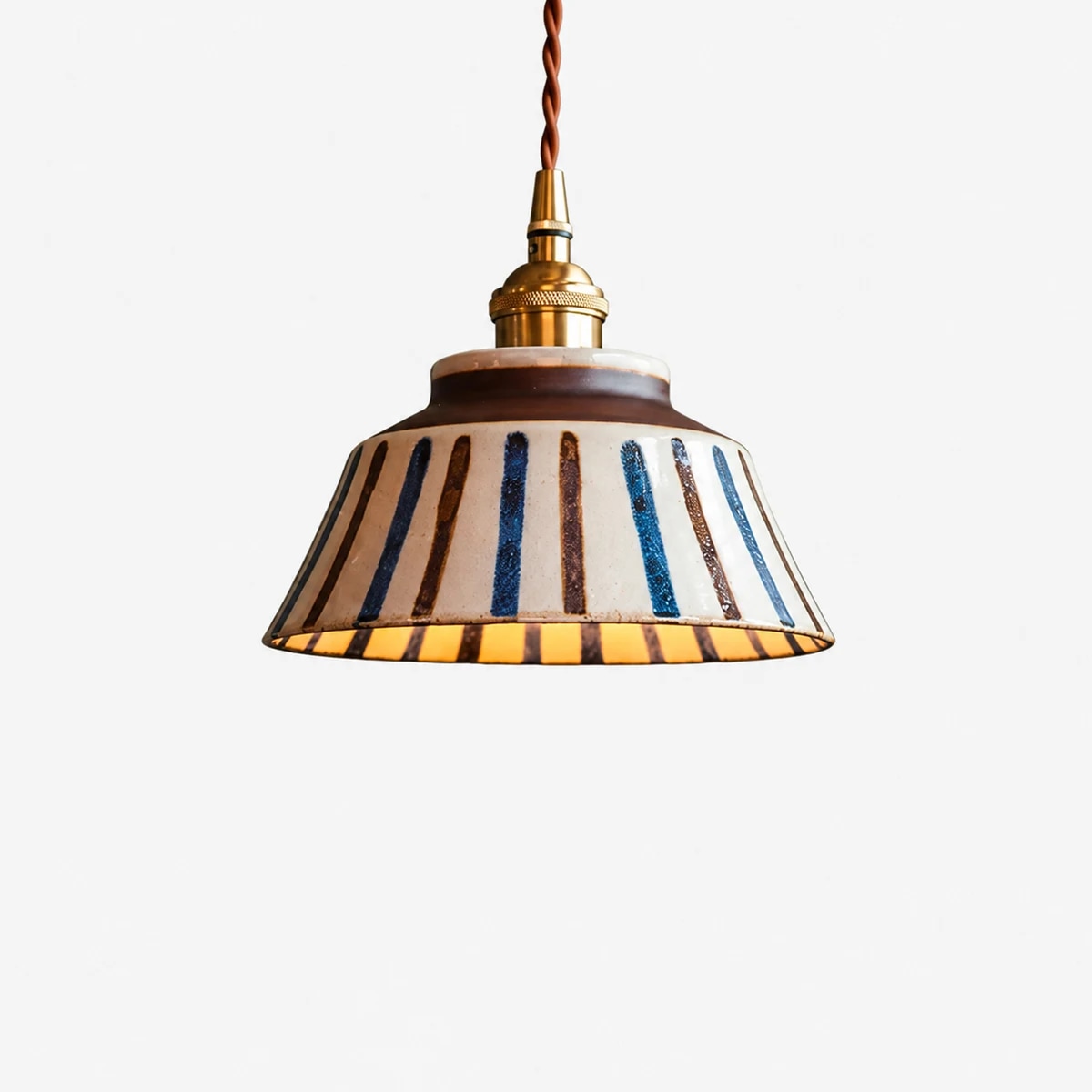 Brass-tone socket and twisted cord detail
