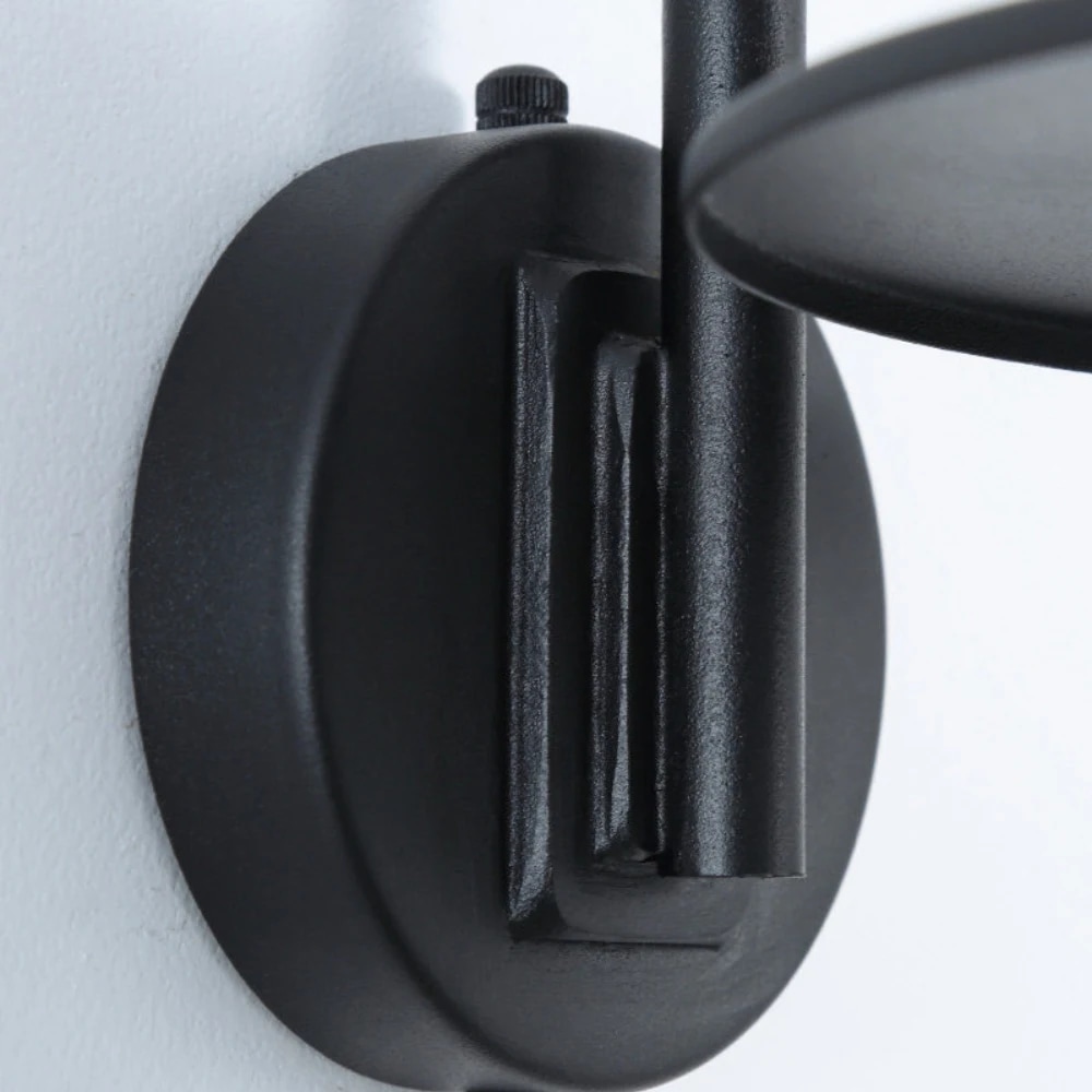 Close view of the wall mount and black metal finish