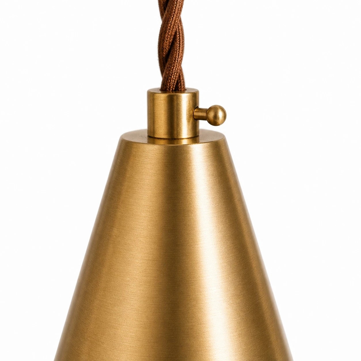 Brushed brass cap and braided cord on the pendant light