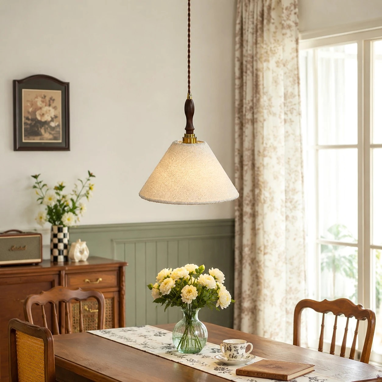French vintage cream pendant light over a wooden dining table