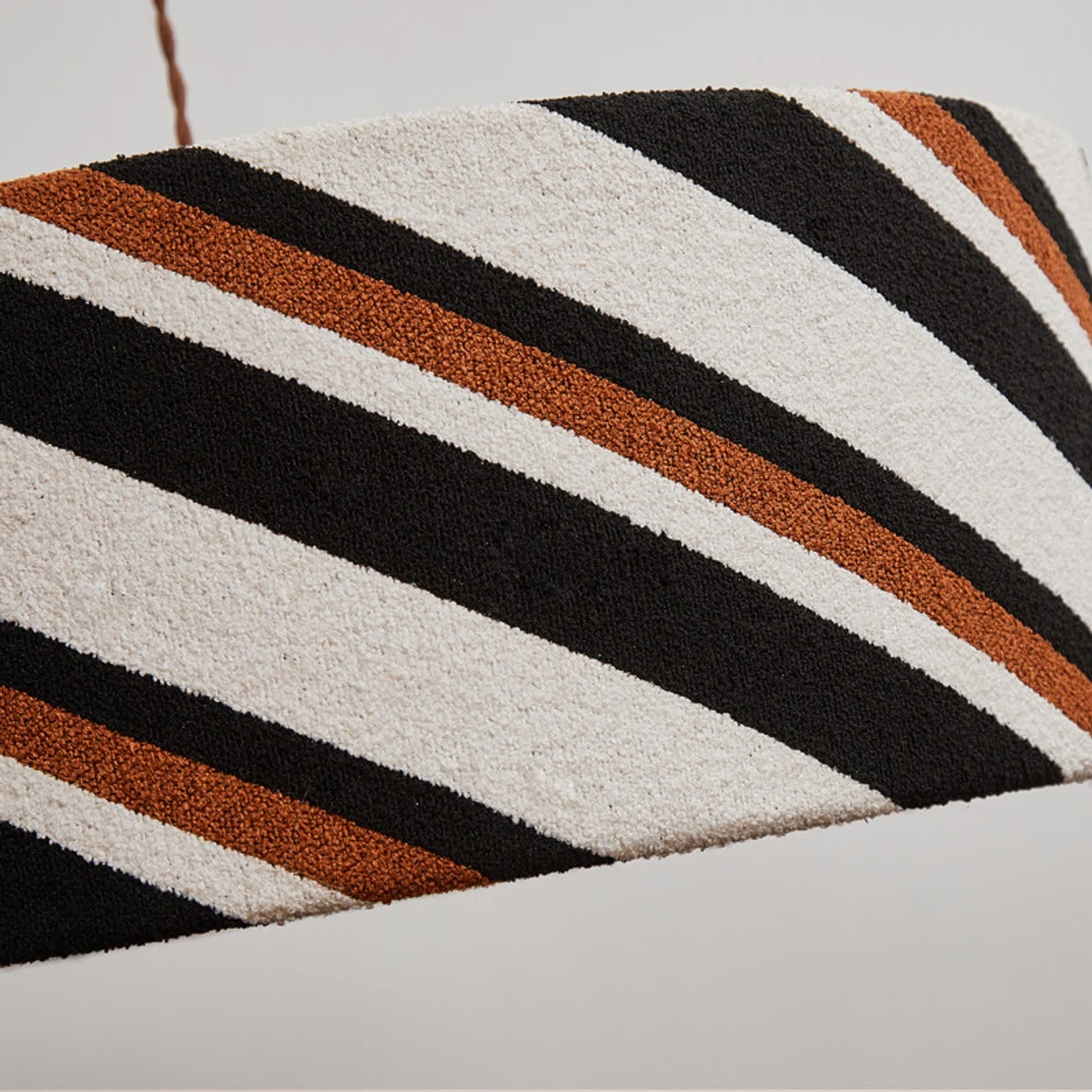 Close detail of the striped fabric pendant shade