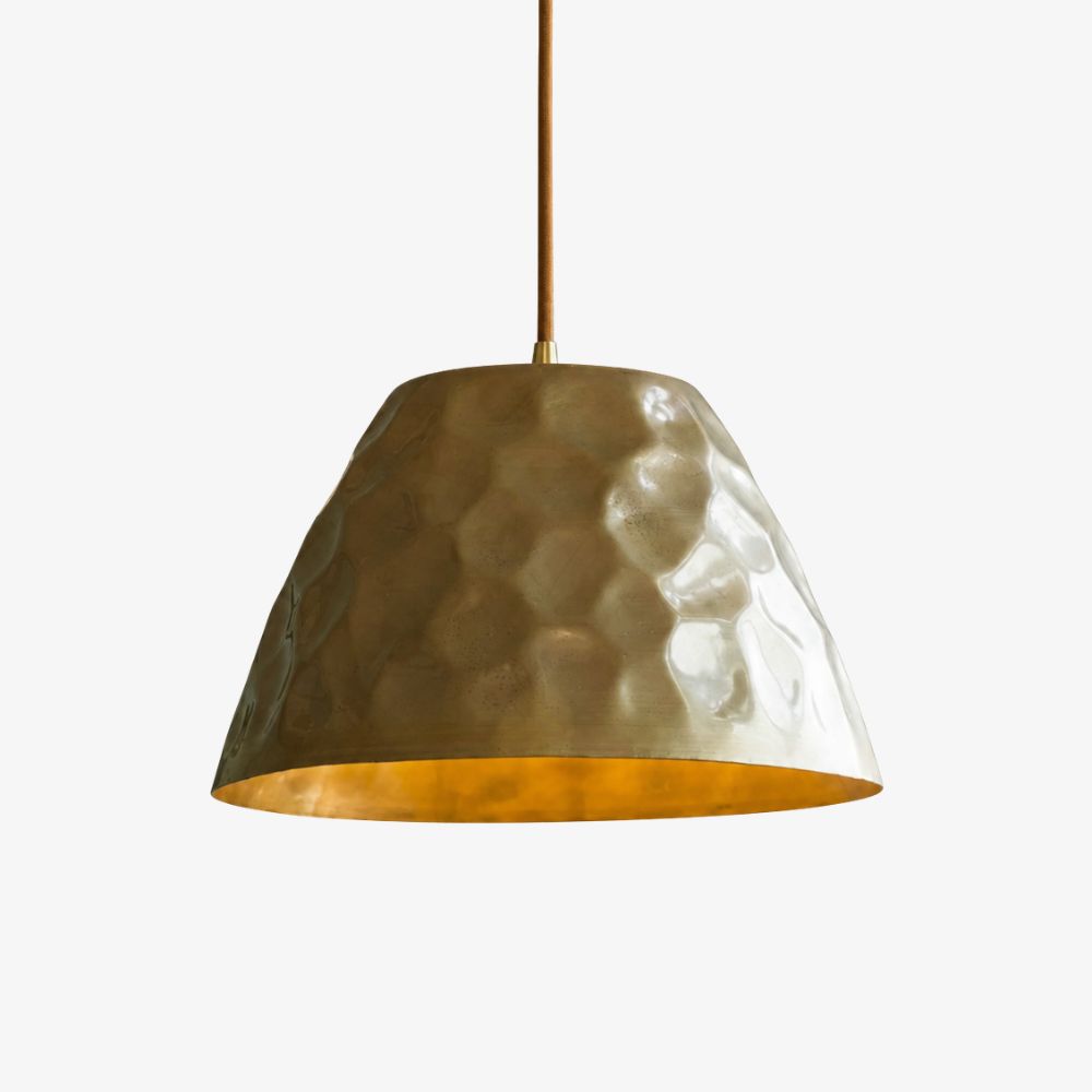 Hammered brass pendant light with warm metal shade