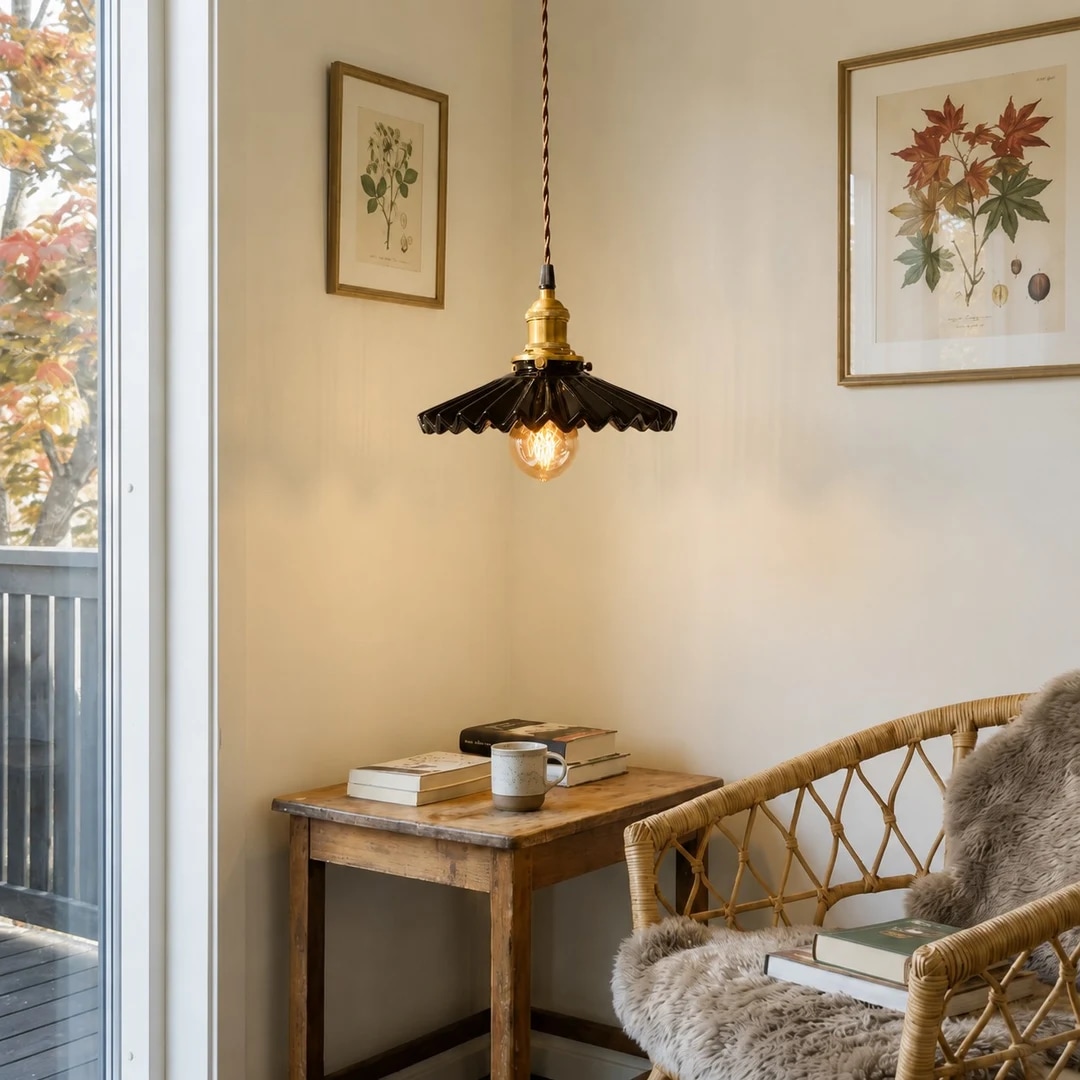 Pleated ceramic pendant light hanging in a reading corner