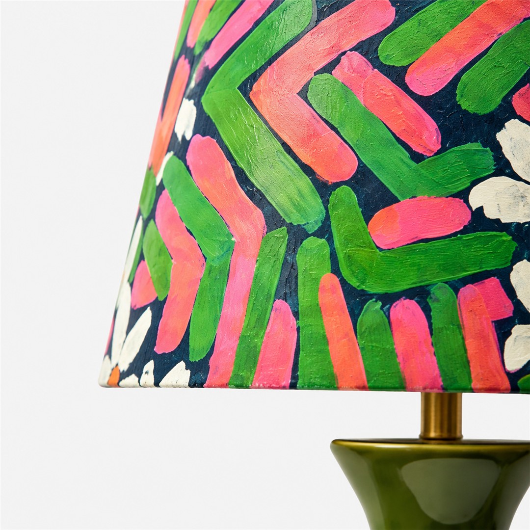 Close-up of fabric shade and green ceramic base connection