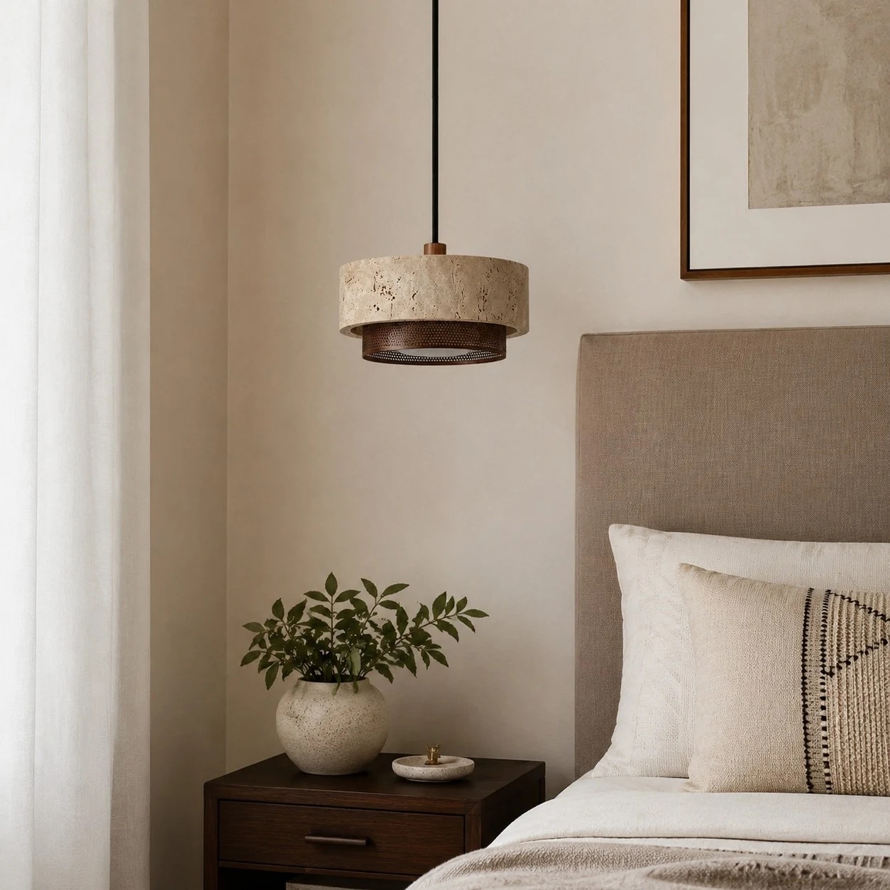 single travertine walnut pendant light beside a warm neutral bed