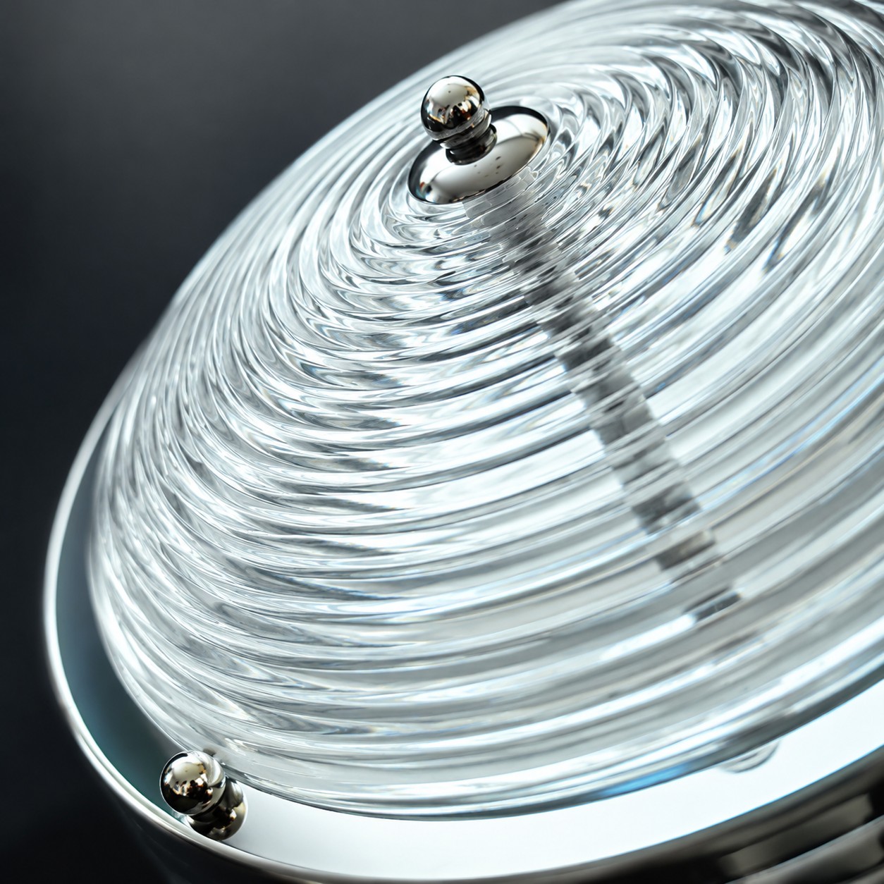 Close-up of rippled glass diffuser and chrome hardware
