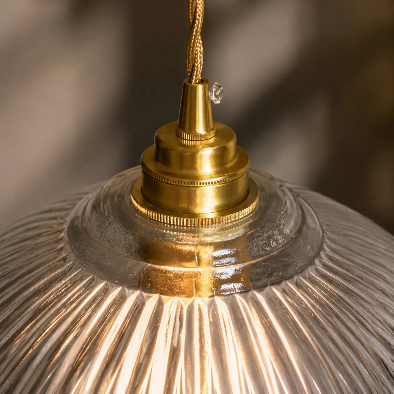 Brass cap and ribbed glass shade detail