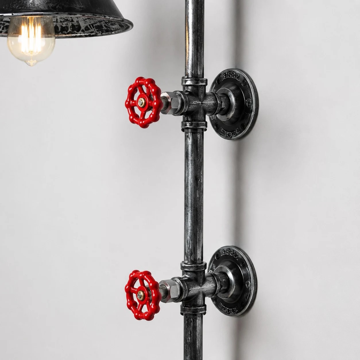 Red valve handles and wall mounting plates detail