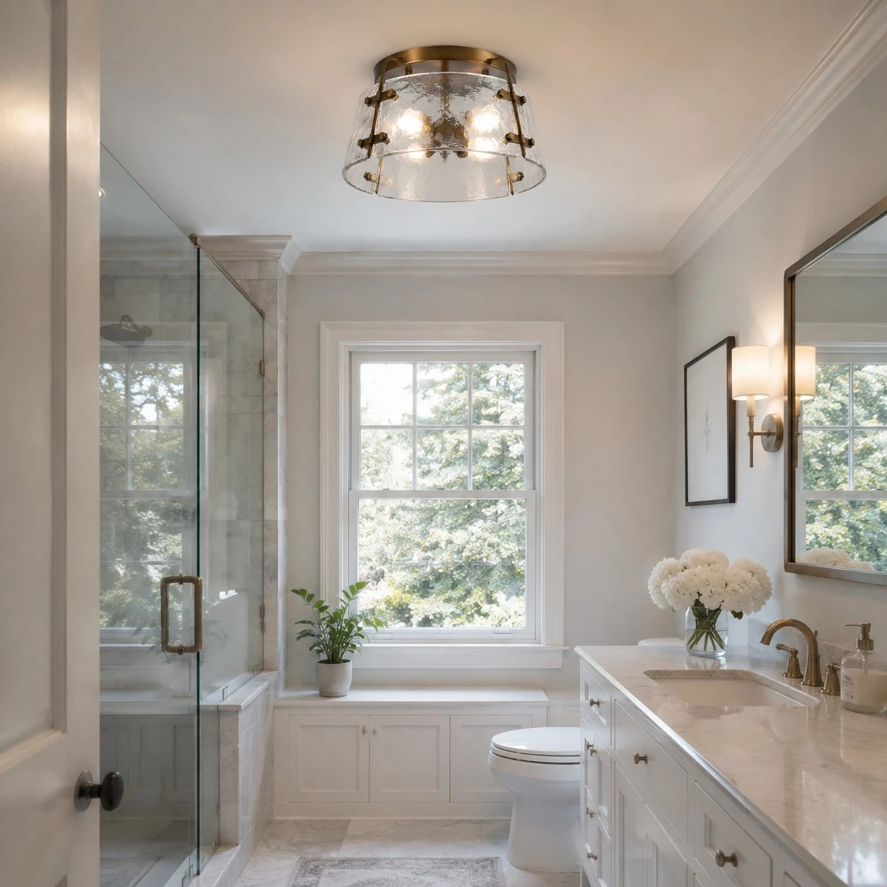 Close detail of clear glass and brass ceiling light frame