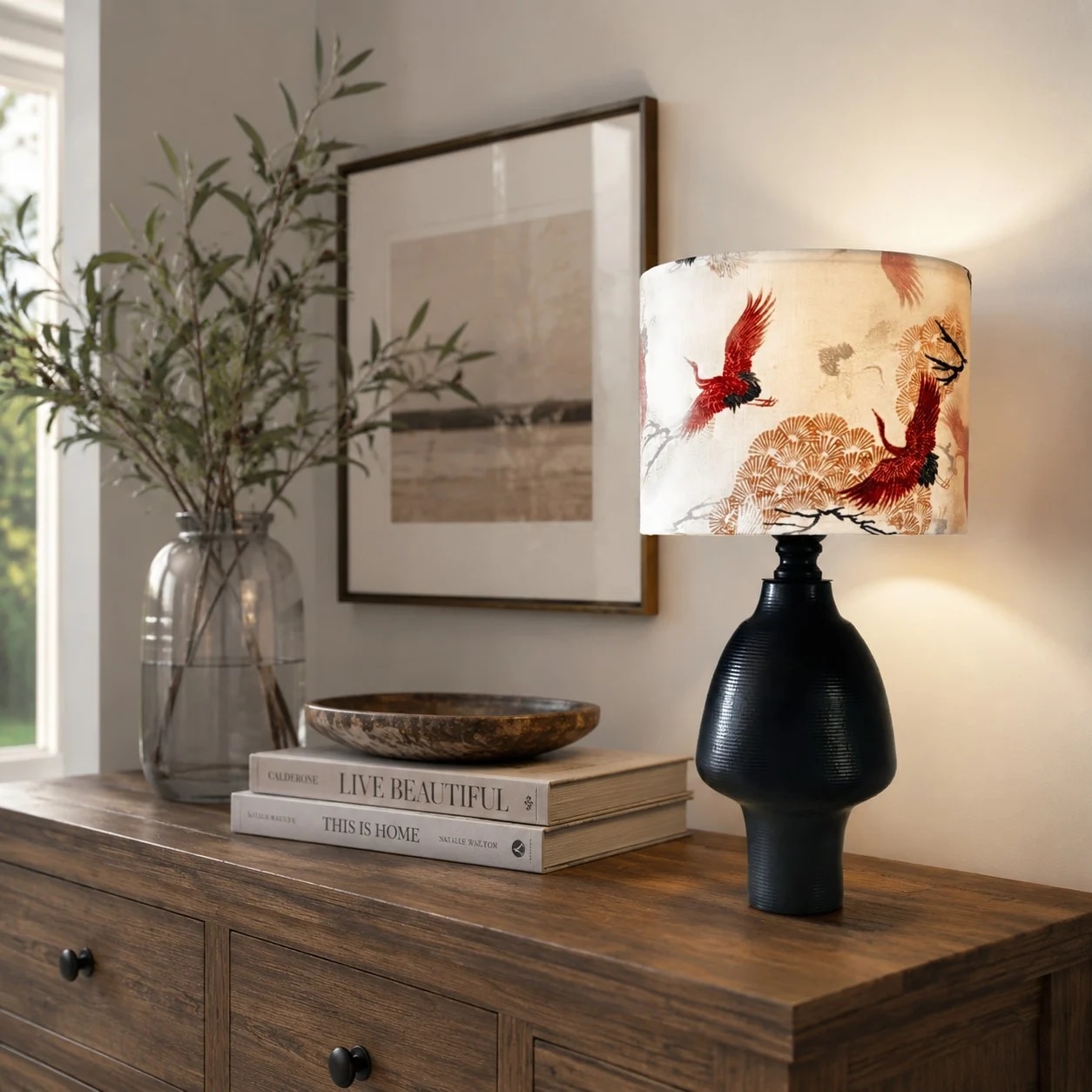 Chinoiserie crane table lamp styled on a wooden console
