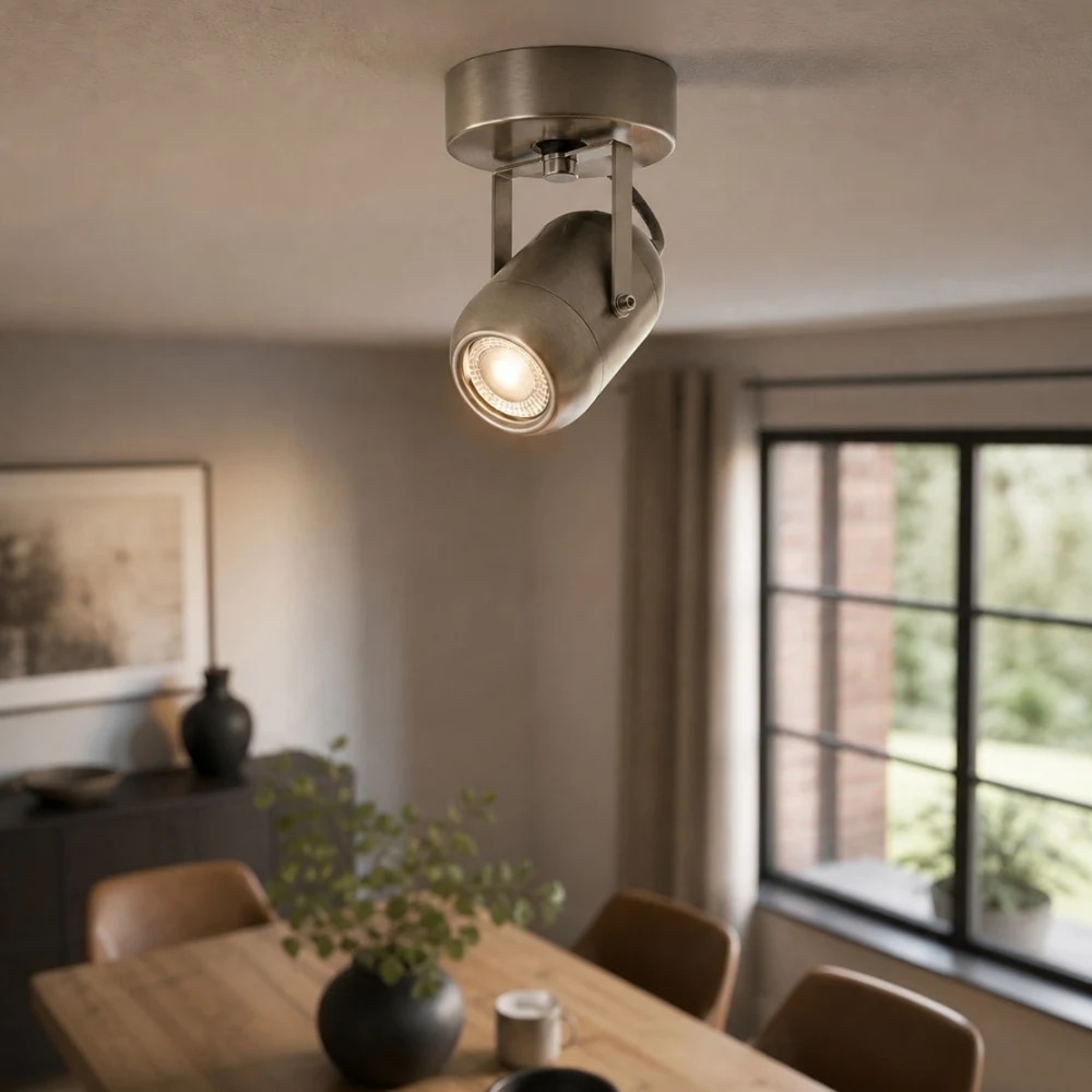 Sand nickel adjustable LED wall lamp used as accent lighting in a dining space