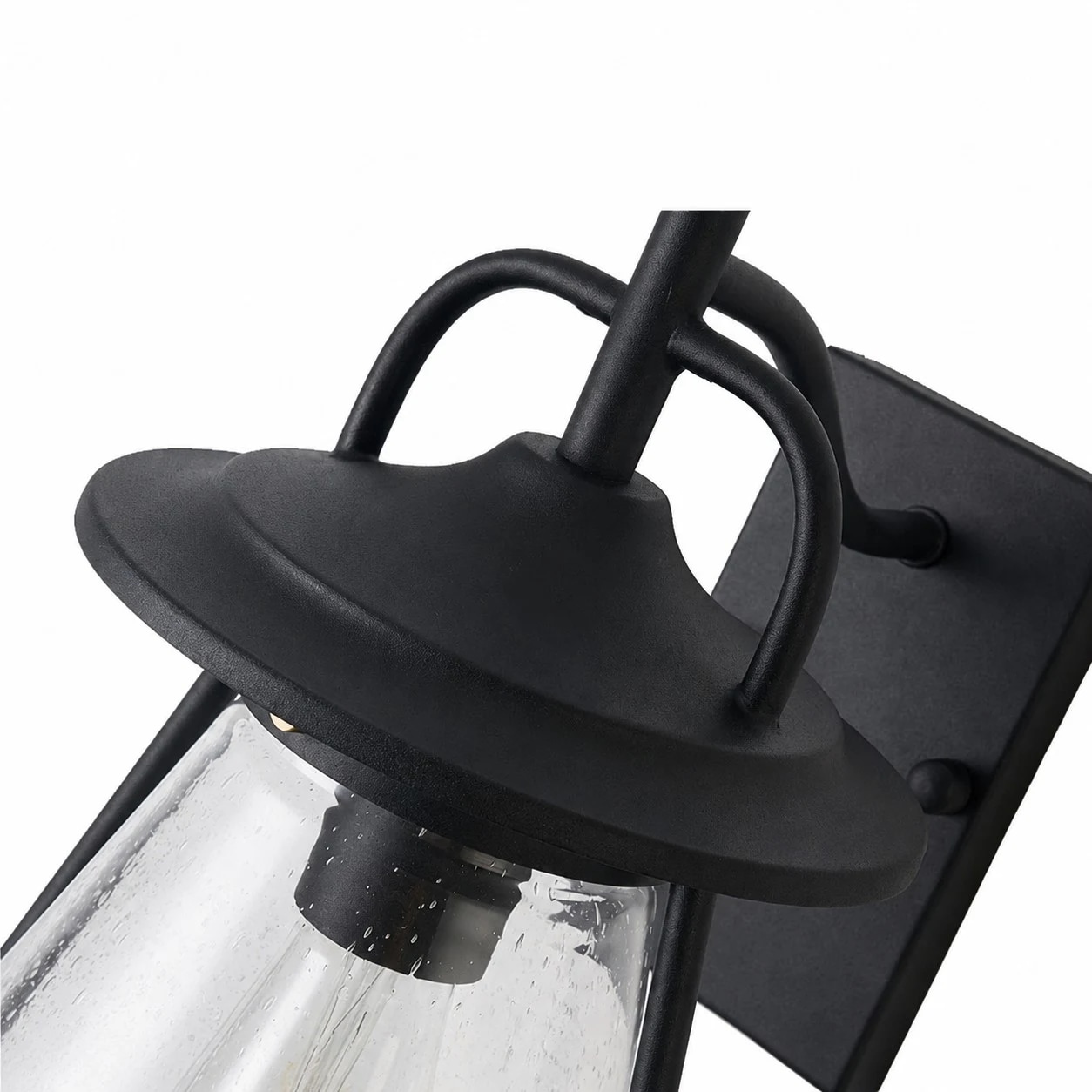 Matte black curved arm and clear glass shade detail