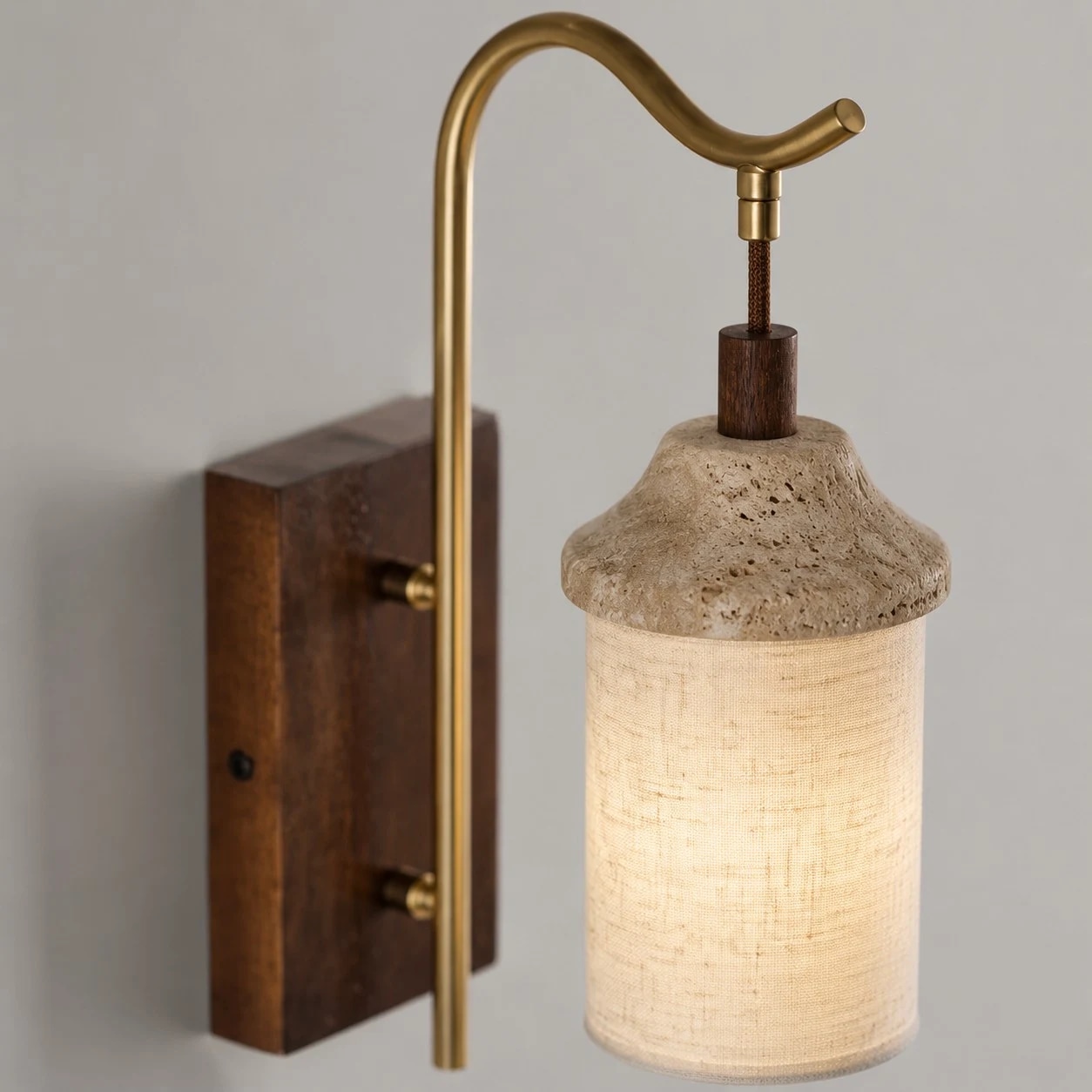Close view of walnut backplate and brass-tone arm