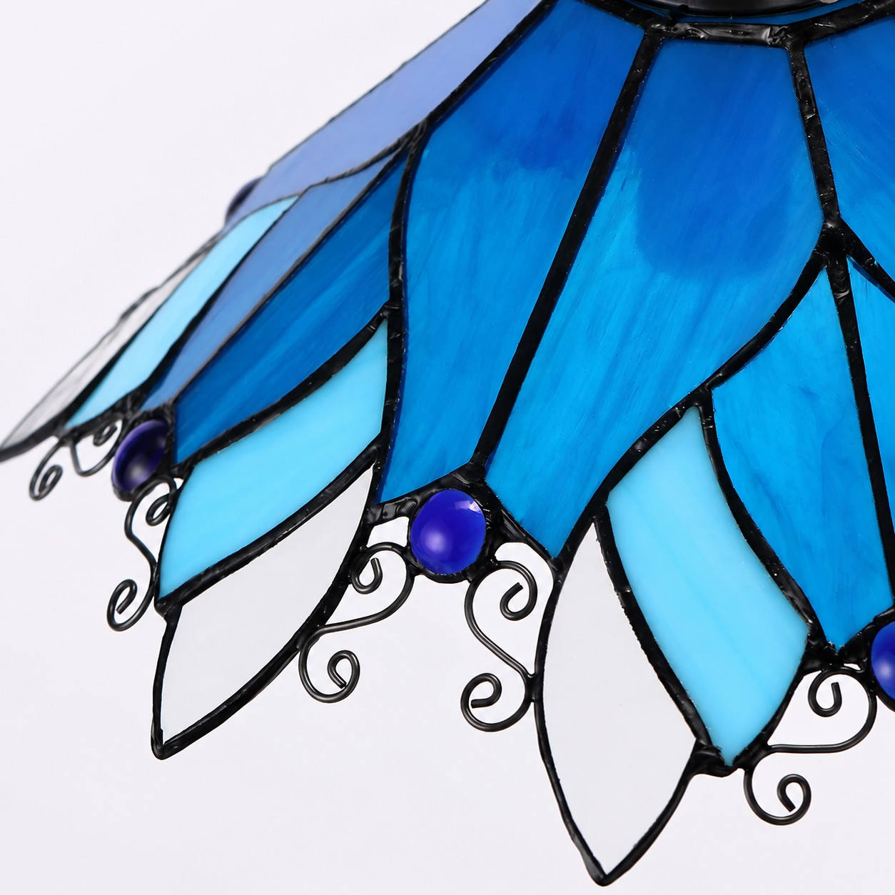 Blue Stained Glass Wall Sconce With Curved Arm glass detail