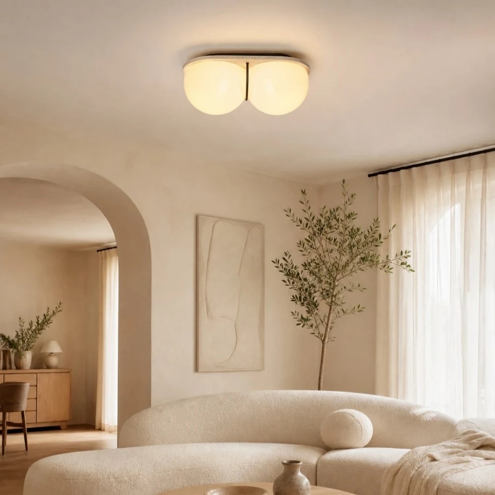 Double globe ceiling lamp installed in a warm interior