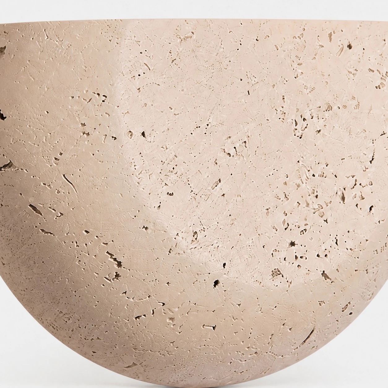 Close view of off-white speckled wall sconce texture