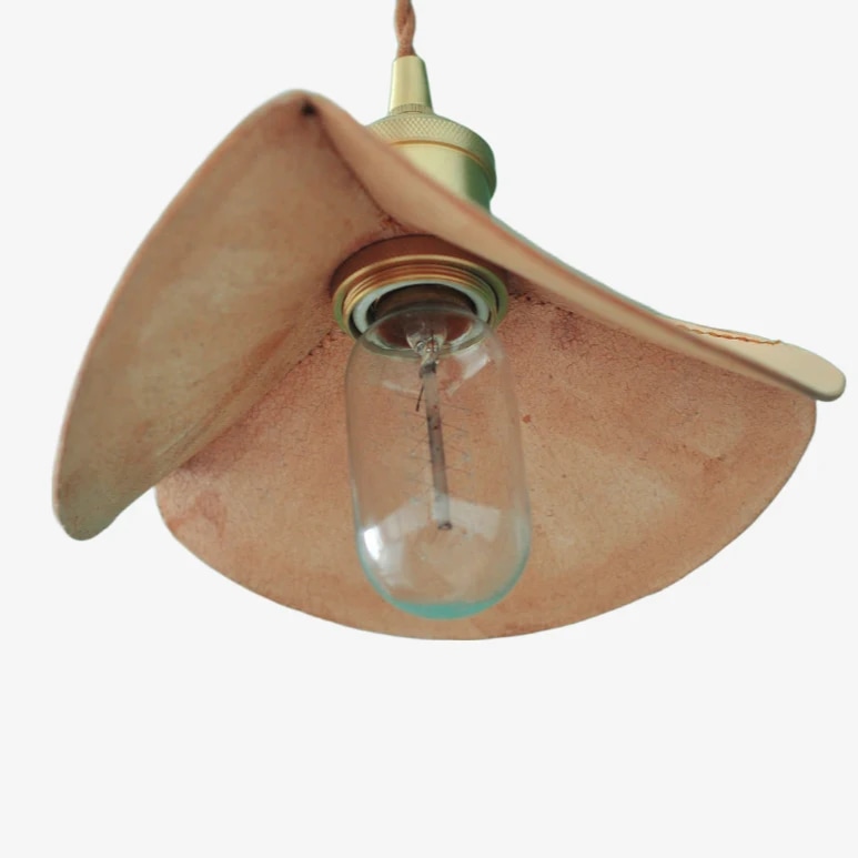Underside view of the leather petal shade and bulb socket