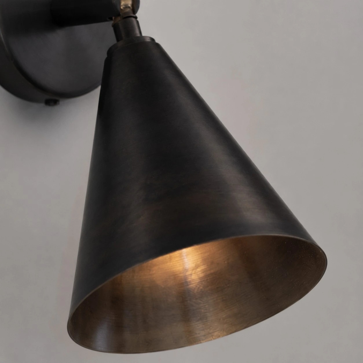 Cone shade and warm inner brass finish close-up