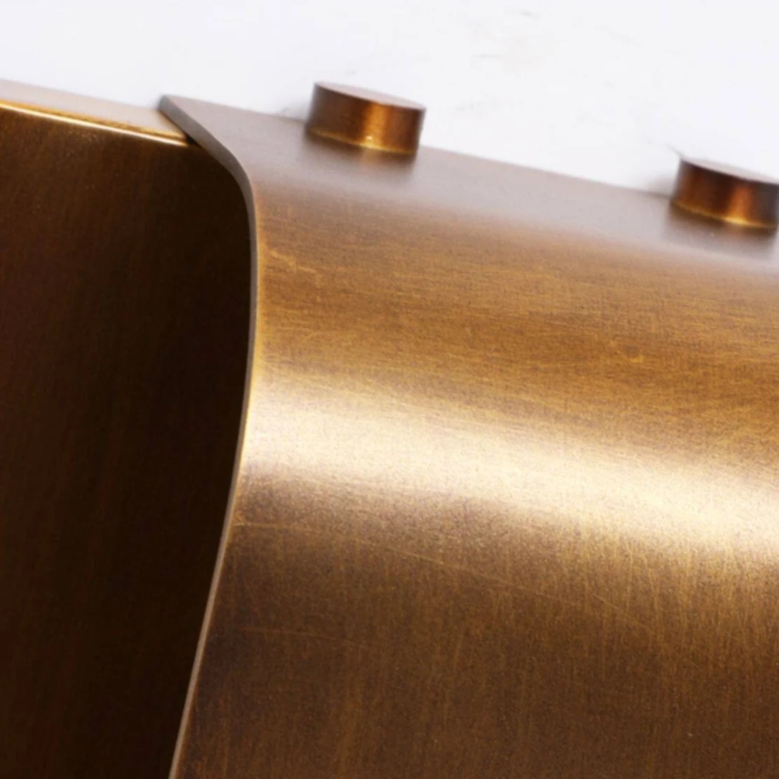 Brushed brass wall sconce finish detail
