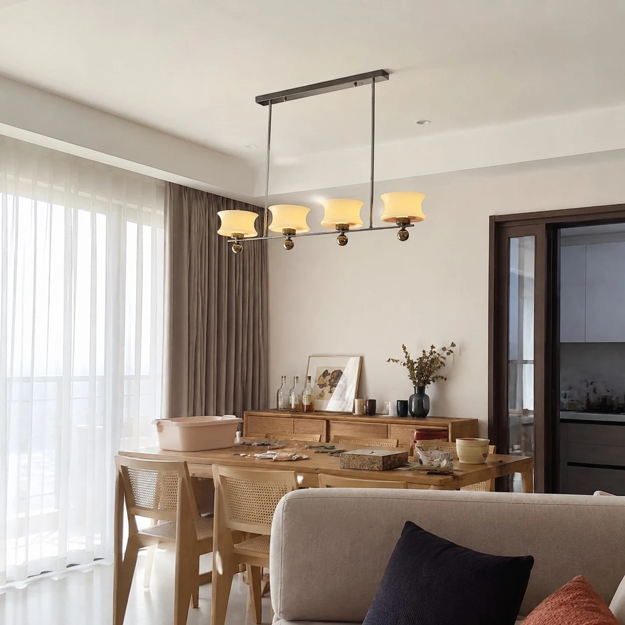 Cream glass chandelier in a relaxed dining and living space