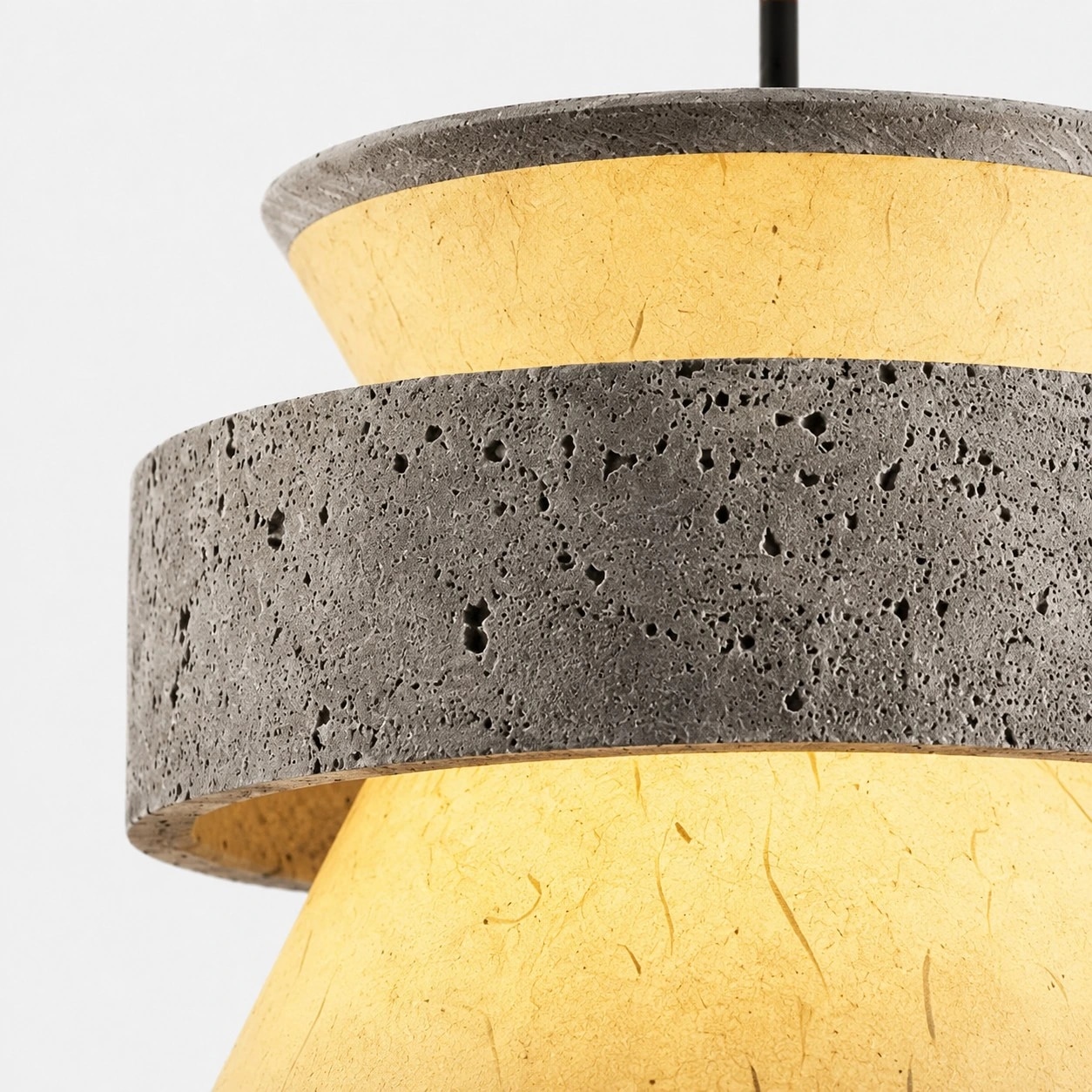 close view of grey stone texture and translucent paper shade