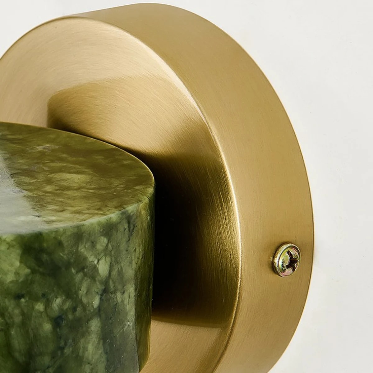 Brass round wall plate and jade stone edge detail