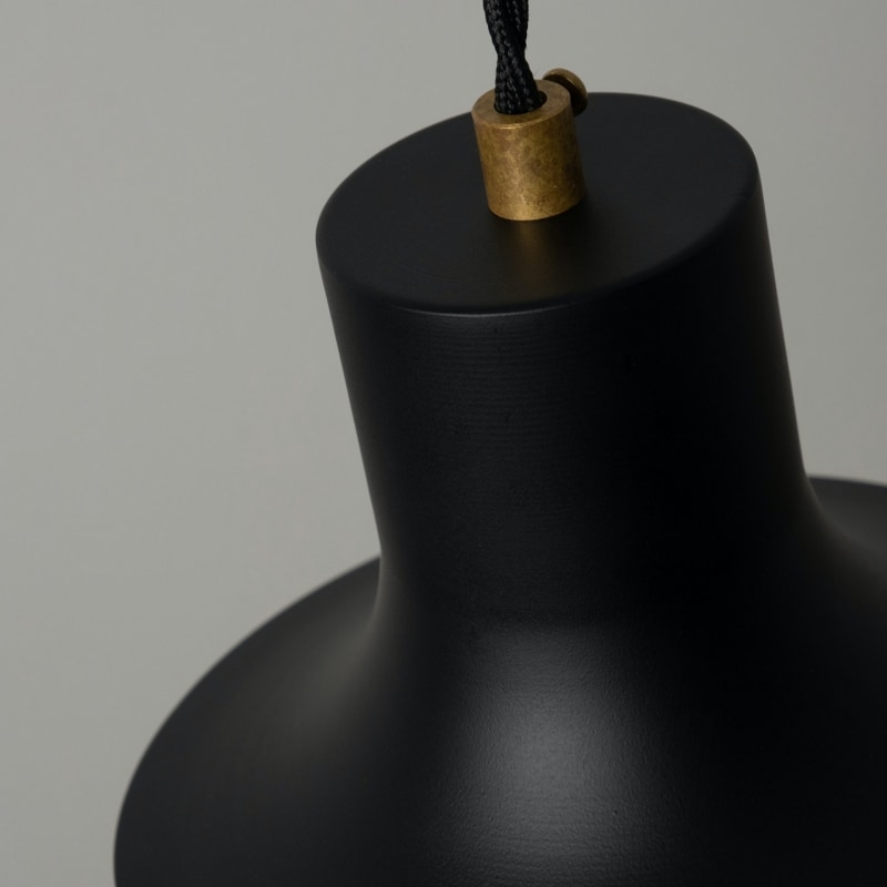 Close view of the pendant top, cord, and metal finish