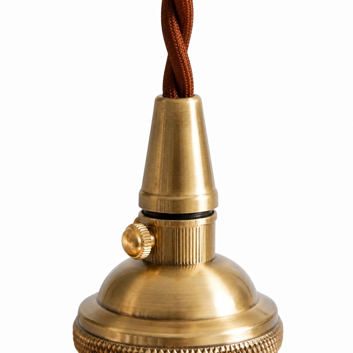 Close view of the copper-tone holder and braided cord