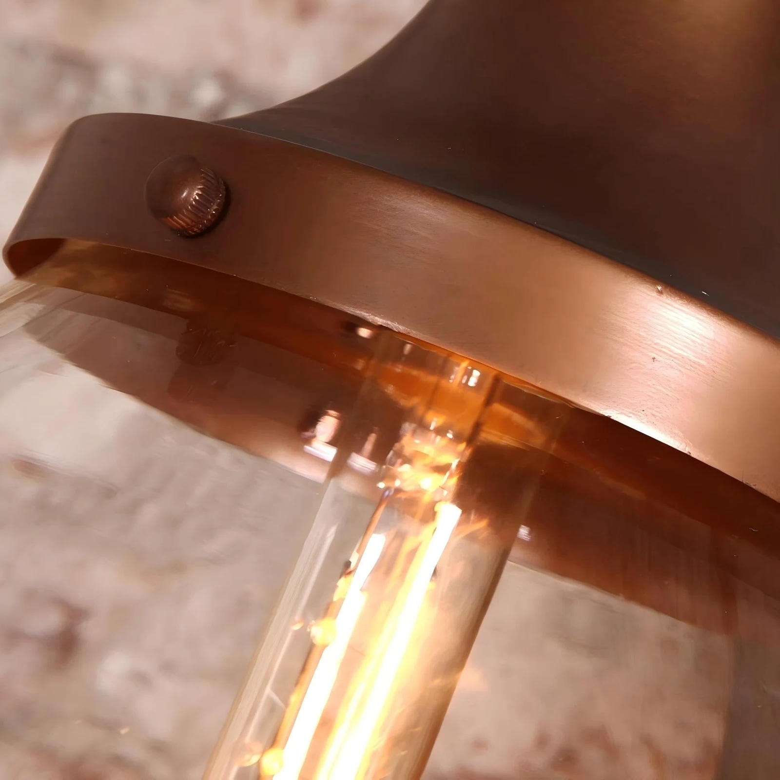Copper-finish iron cap and warm bulb detail