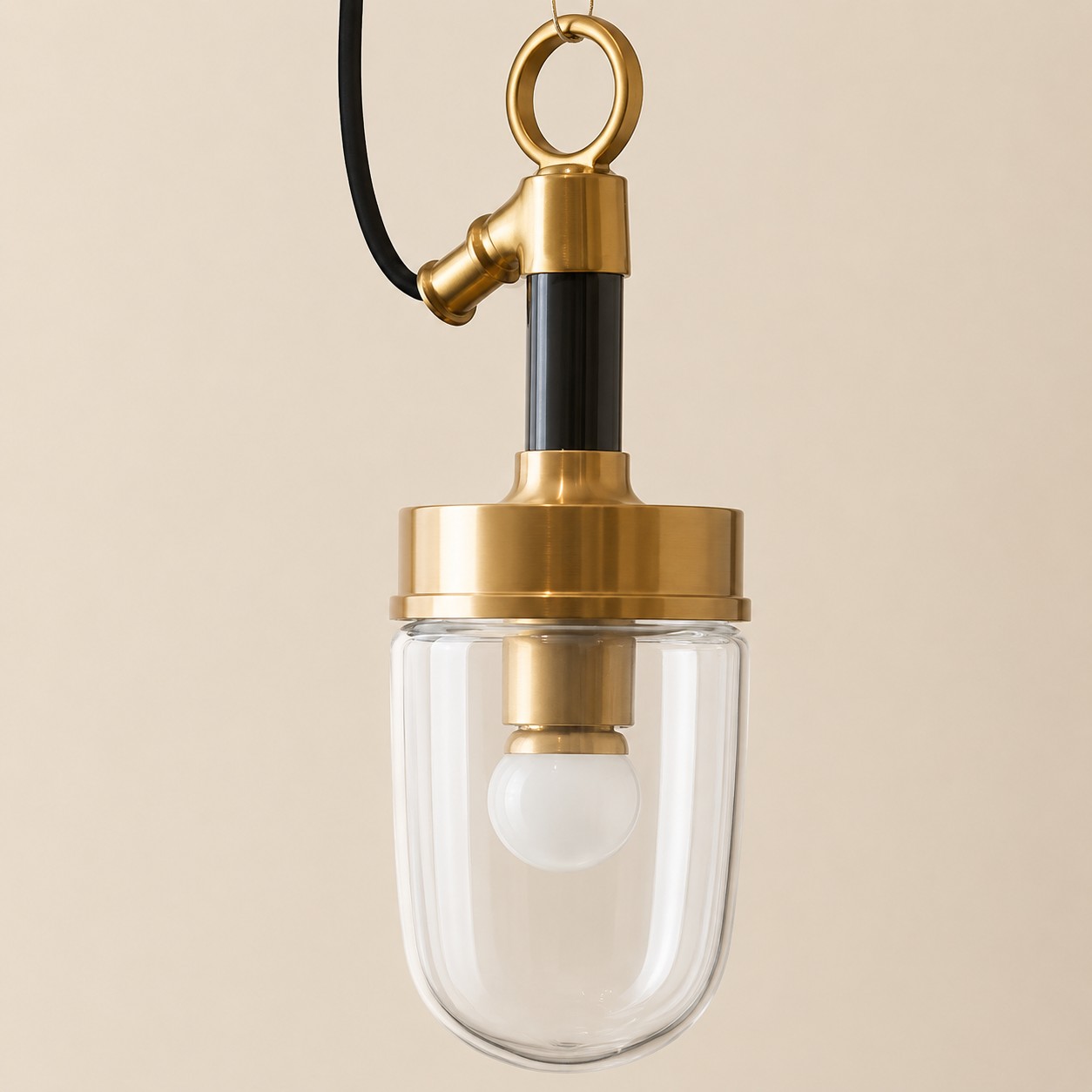 Clear glass shade and brass tone pendant detail