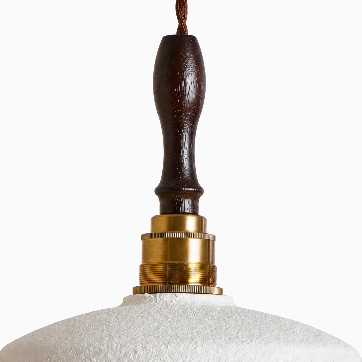 Walnut-colored wood stem and brass-toned connector detail