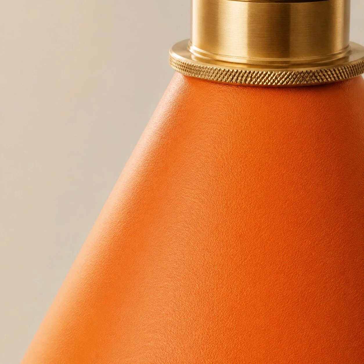 Close view of the stitched leather shade texture and brass ring