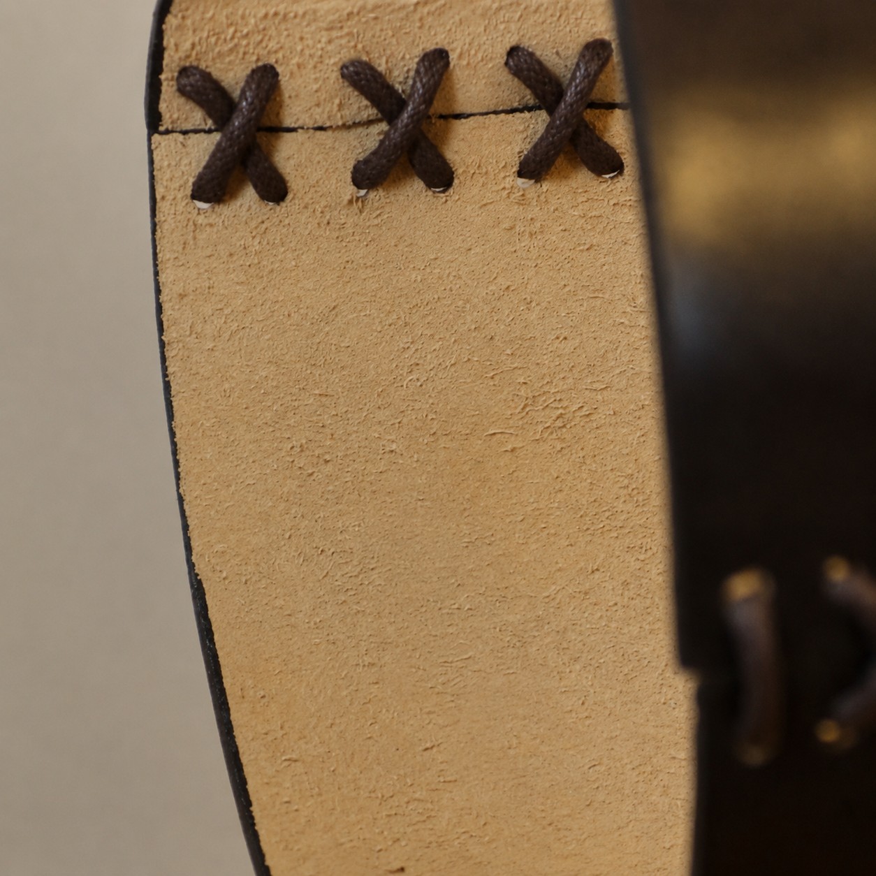 Close-up of leather edge stitching on pendant shade