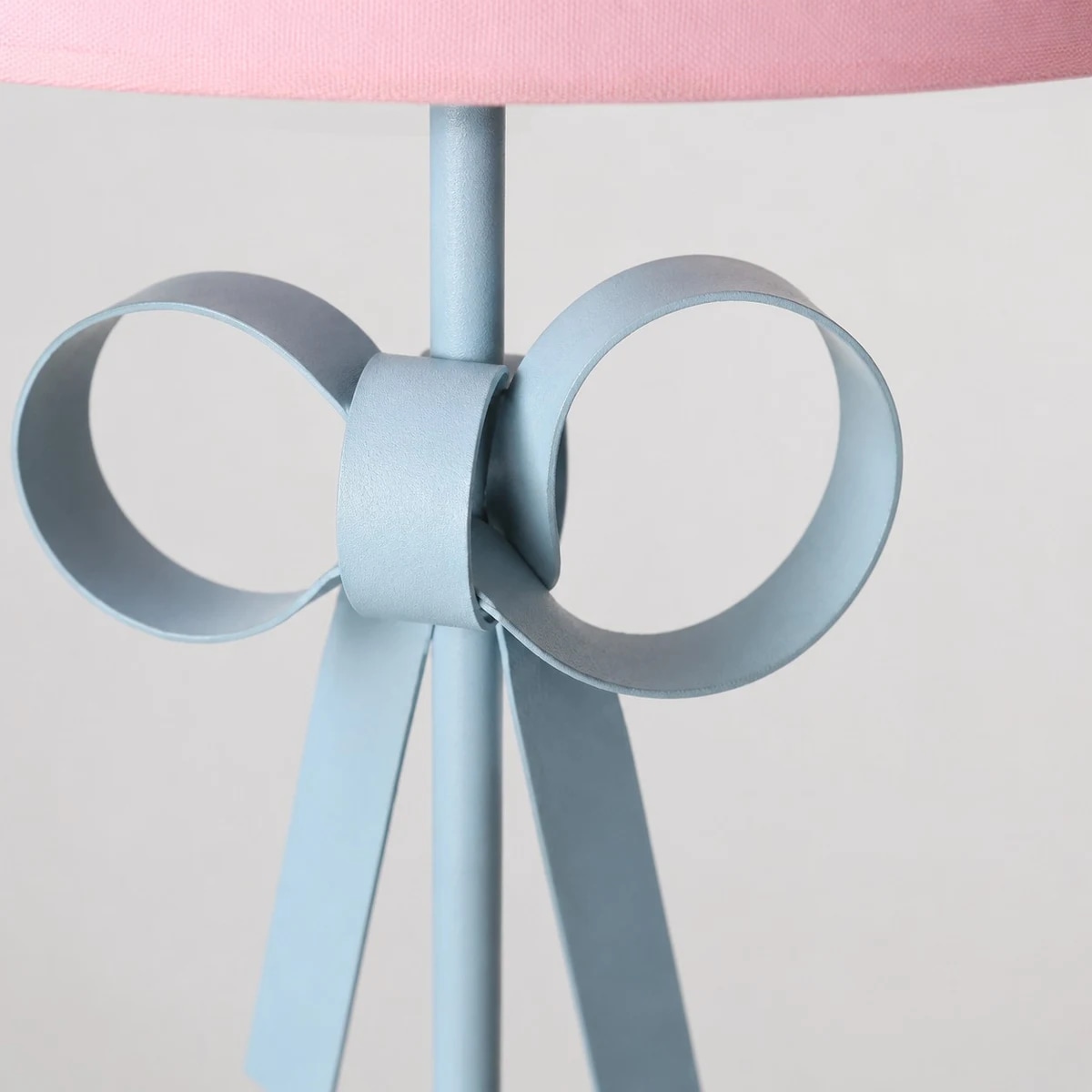 Bow accent below the fabric shade
