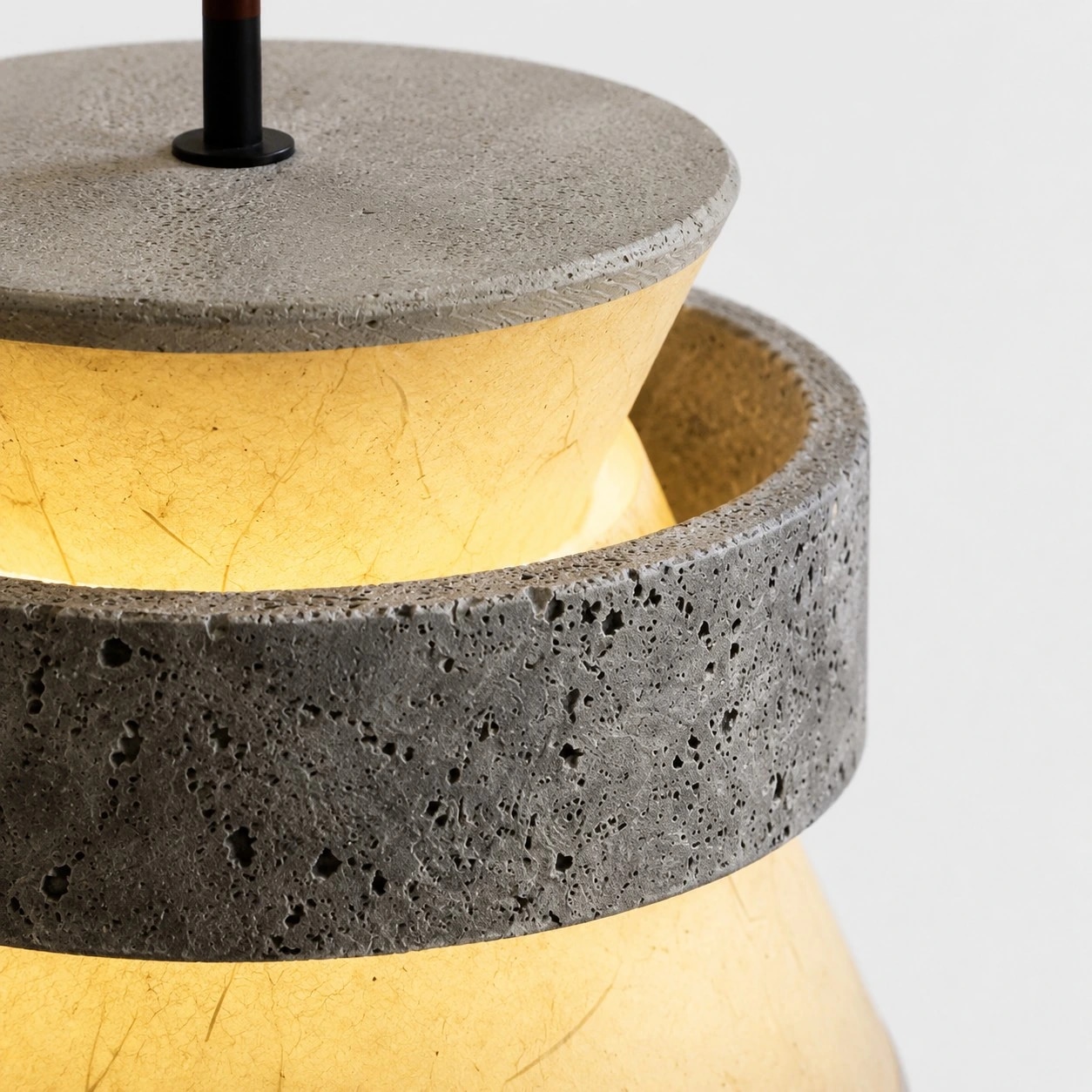 close view of grey stone texture and translucent paper shade