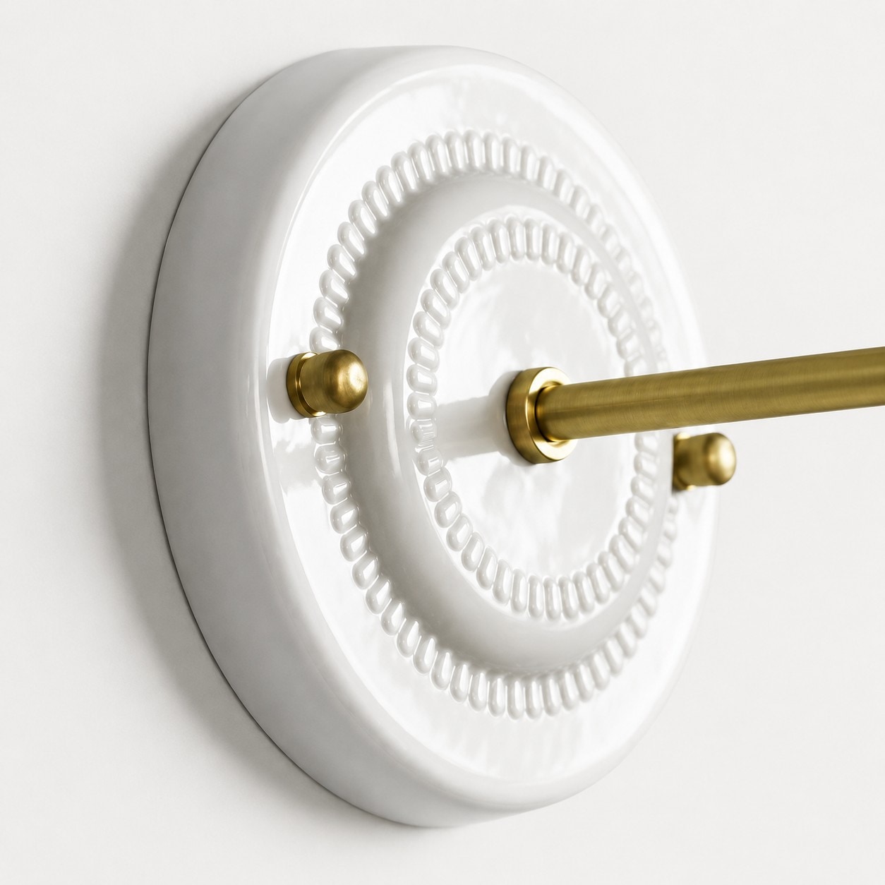 White ceramic wall base plate detail