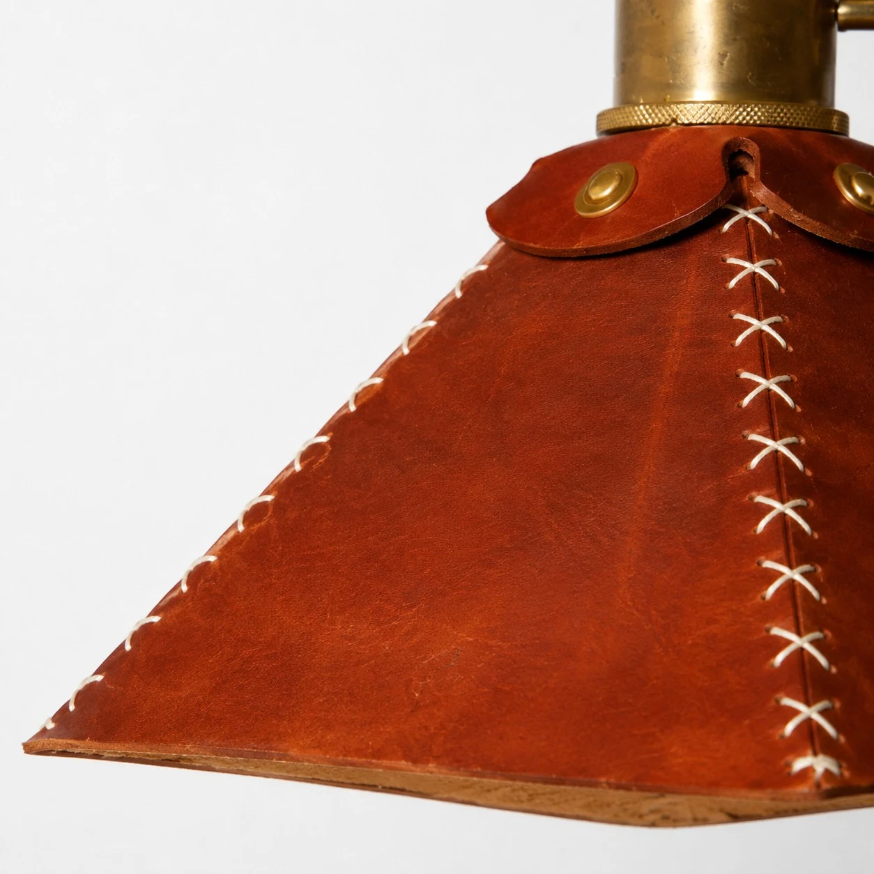 Leather shade lacing and edge detail