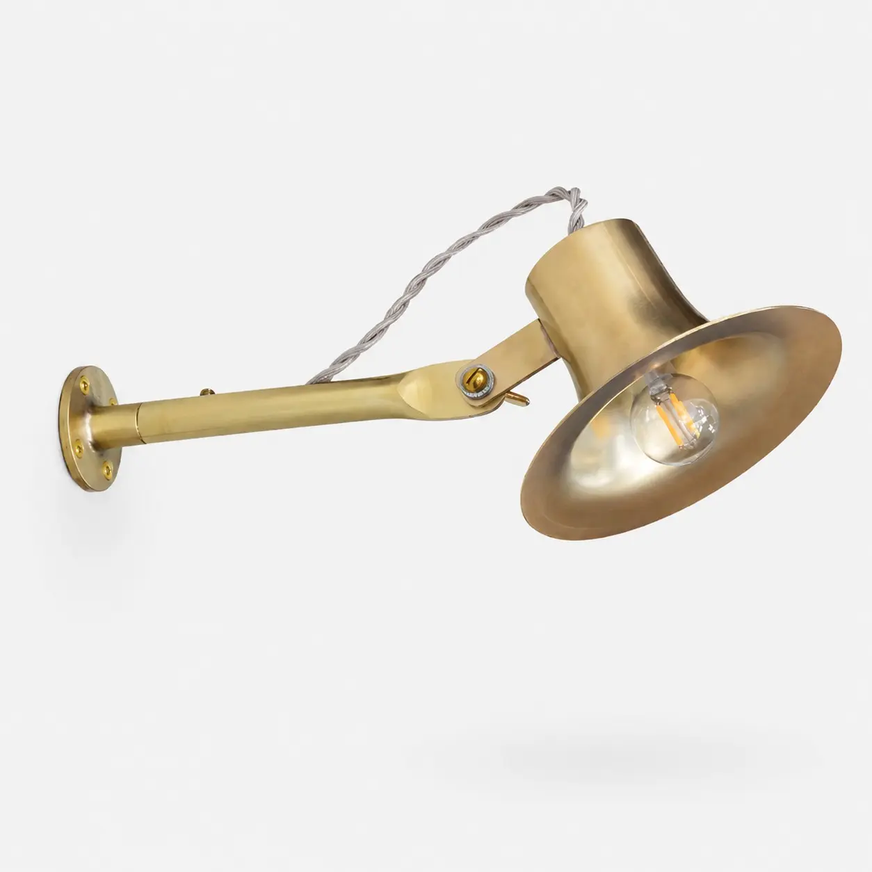 Verstelbare wandlamp van mat messing