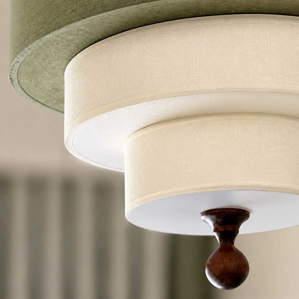 Rounded wood finial detail beneath the fabric shade