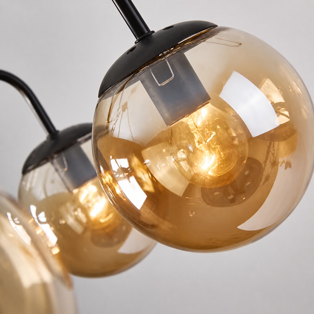 Amber glass globes cast a warm, cozy glow